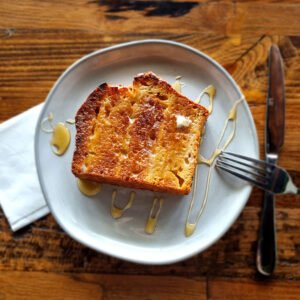 Toasted and served with butter and your choice of warm honey or jam