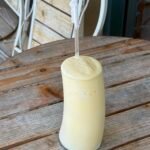 Creamy tropical protein shake with mango and banana.