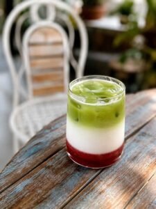 Iced matcha latte with house-made strawberry syrup
