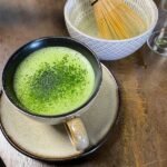 Ceremonial-grade matcha tea with vibrant green foam